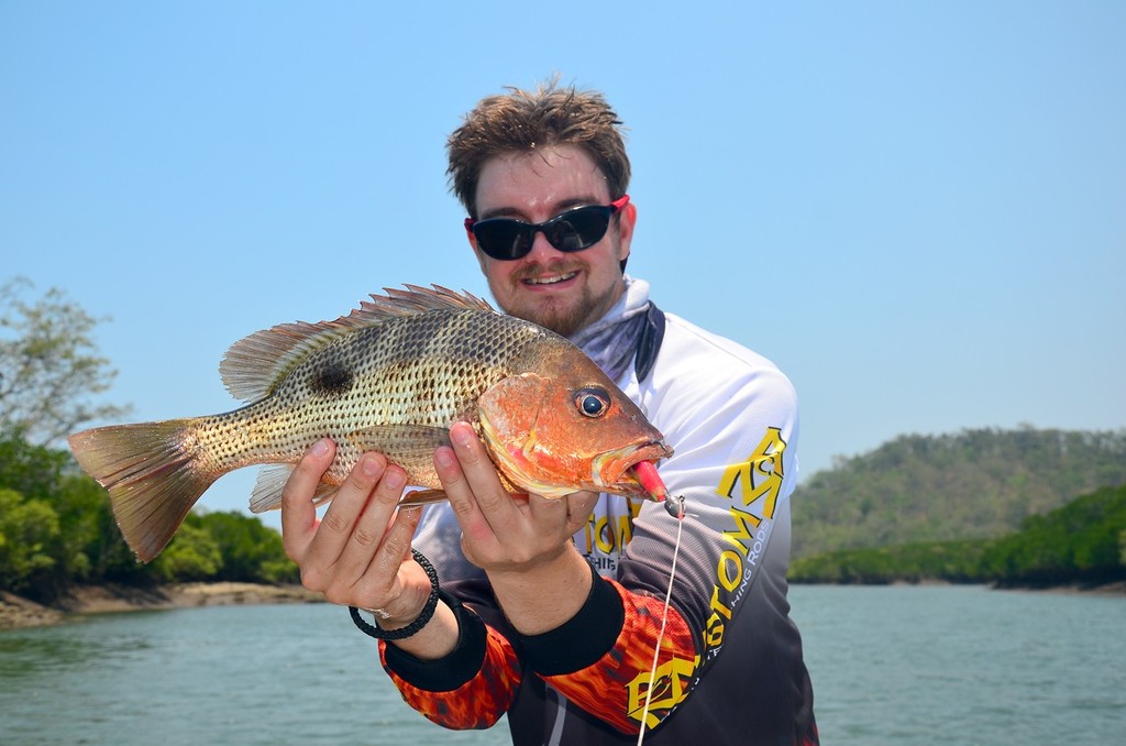 Lee with a legal size little fingermark.  This is a top way to catch a feed in the barramundi closed season and has little chance of big breeding barra bycatch. © Lee Brake